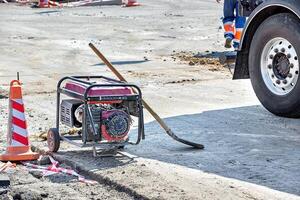 Construction site with generator and equipment on a sunny day in an urban setting. Copy space. photo