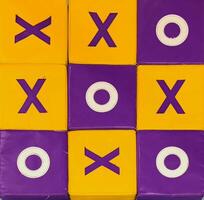 Colorful Tic Tac Toe Grid with X and O Symbols on Blocks photo