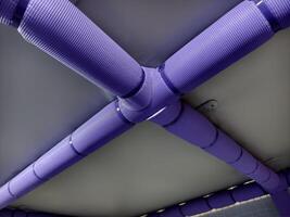 Purple Textured Pipes in Industrial Ceiling Structure with Unique Design photo