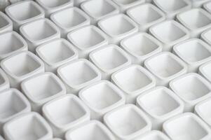 white plaster vessels blanks for candlesticks. rectangular cups cast from plaster in a candle workshop. High quality photo