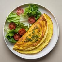 Savory omelet plated with a fresh salad, creating a healthy and delicious breakfast or brunch. photo