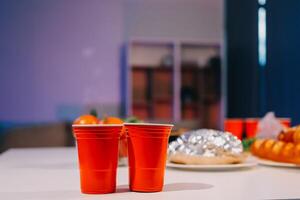 Two red cups on a table photo
