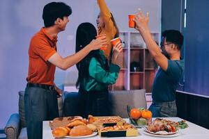 A group of people at a table with food photo