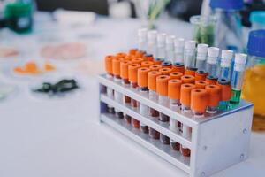 A table with a bunch of tubes and bottles photo