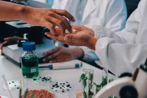 A group of people in lab coats are holding something photo