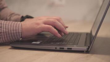 A closeup and detailed view of hands actively typing on a laptop, showcasing modern work habits and practices video