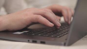 A close-up view of hands typing on a laptop keyboard, ideal for remote work or online learning themes. video