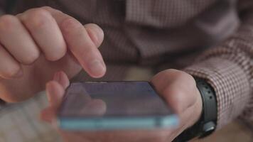 Detailed view of a person interacting with a smartphone, showcasing modern convenience and technology use. video