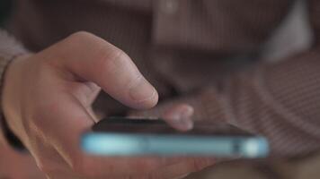 A closeup of a hand actively using a smartphone, vividly showcasing modern technology and daily life experiences video