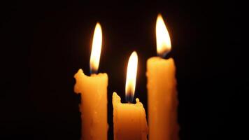 Softly glowing candles illuminate the space, creating a calm atmosphere for meditation in the darkness video