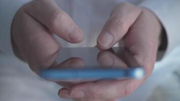 A closeup of hands using a smartphone, showcasing current digital interaction trends in todays world video