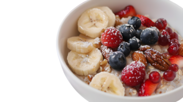 A bowl of fresh fruit and yogurt topped with banana slices berries nuts and a sprinkle of p png