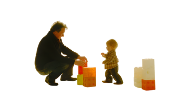 Adult and Child Playing with Building Blocks A Heartwarming Scene of Bonding and Creativity png