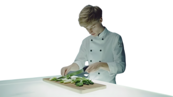 Chef in Action Cutting Fresh Vegetables on a Cutting Board for Culinary Preparation png