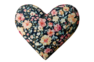 Floral heart shaped pillow, decorative home accessory, soft fabric, colorful design, perfect for cozy living spaces. png