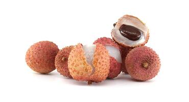 Freshly Plucked Lychee Fruits on White Background Displaying Their Juicy Pulp and Seed photo