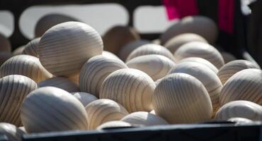 Wooden eggs fill a crate, ideal for Easter decor and crafting projects. Rustic charm photo