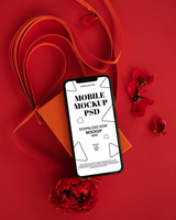 Mobile mockup design with red background and decorative elements psd