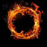 Fiery ring composed entirely of flames against a black background. The flames form a perfect circular shape, with bright orange, yellow, and red hues that flicker and twist. photo
