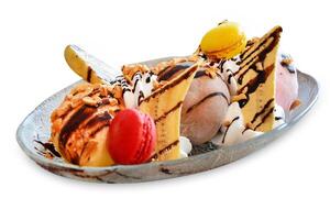 Top view of ice cream with banana and chocolate sauce and Macarons, focus selective photo