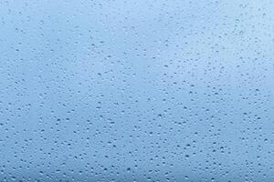 Rainfall creates a soothing atmosphere on a clear blue sky background, enhancing the calmness of the surroundings during a quiet afternoon photo