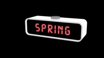 Digital clock displaying the word Spring on black video