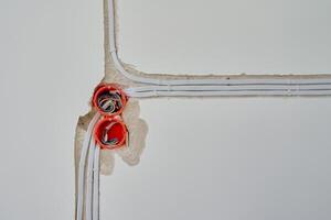 Electrical wiring installation with wires and wall sockets photo