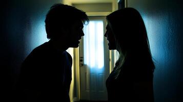Tense confrontation between a couple in a dimly lit hallway, showcasing emotional intensity and conflict, highlighting relationship struggles concept photo