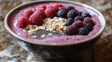 Refreshing berry smoothie bowl topped with oats and chia seeds for a healthy breakfast option photo