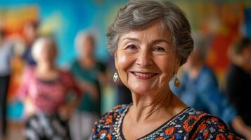 Smiling elderly woman enjoys dance class with friends in colorful studio setting photo