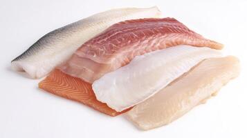 Freshly filleted fish assortment showcasing various types and colors ready for culinary preparation photo