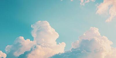 Clouds drift peacefully across a bright blue sky during a serene afternoon photo