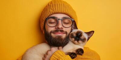 Comforting bond between a man and his cat against a warm yellow background, capturing a moment of love and tranquility in a cozy setting photo