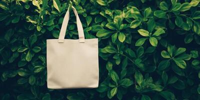 White tote bag hanging against a vibrant green foliage backdrop during midday photo