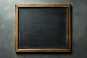 Blank chalkboard in a rustic wooden frame set against a textured wall interior photo