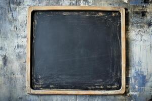 Chalkboard on a rustic wooden wall with a weathered frame highlighting a blank canvas for creativity photo