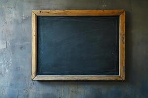 Empty chalkboard hanging on a textured wall in a classroom setting during daylight hours, inviting thoughts and creativity photo