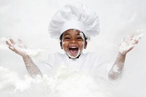 Joyful child chef creates a flour explosion while baking in a bright kitchen photo