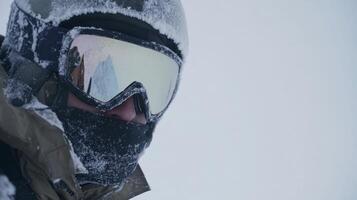 Winter adventure in a snow-covered landscape with a person wearing ski gear and goggles photo