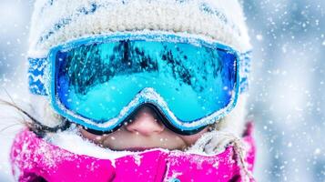 Child enjoying snowy weather while wearing bright winter gear in a cold outdoor environment photo