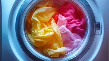 Colorful fabrics swirling in washing machine during laundry process showcasing vibrant hues and textures, emphasizing the joy of cleaning clothes concept photo