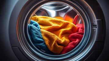 Colorful laundry spinning in washing machine drum, showcasing vibrant textiles and fabrics, illustrating modern home cleaning practices, laundry day concept photo