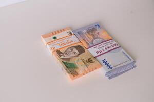 Stacks of Indonesian Rupiah Banknotes, Financial Wealth Concept photo