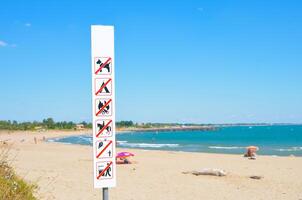Warning on the beach that is forbidden photo
