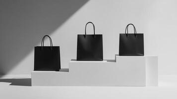 Elegant black bags arranged on white steps with dramatic shadows highlighting their forms and creating a minimalist aesthetic photo