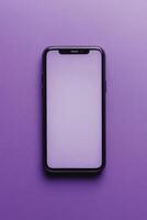 Modern smartphone with blank screen placed on vibrant purple background for creative design or marketing use photo