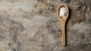 Cooking with natural sea salt on rustic stone surface during a culinary preparation photo