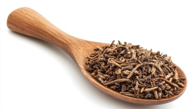 Dried spice on wooden spoon showcasing texture and color in natural setting photo