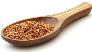 Spice blend in a wooden spoon showcasing texture and color for culinary use photo