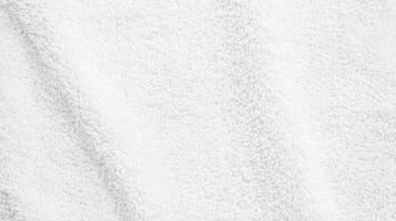 Soft white towel fabric with gentle texture and fluffy appearance suitable for various uses in home and spa settings photo